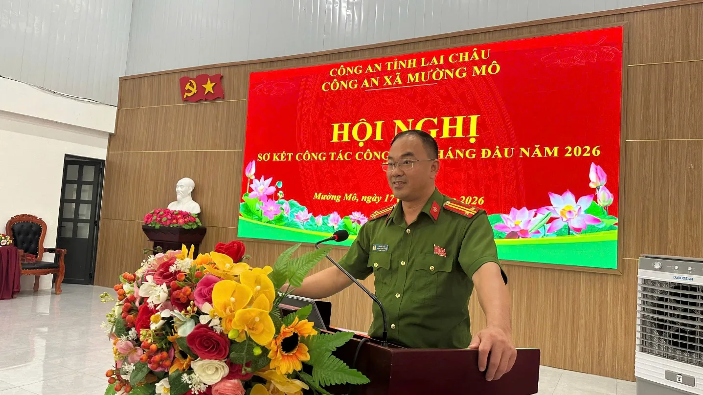 A person in uniform standing at a podium with a microphone

Description automatically generated